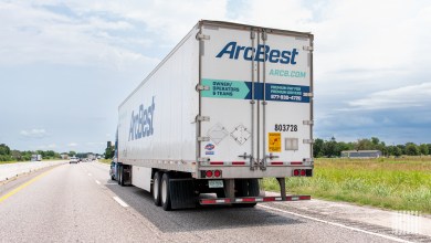 an ArcBest trailer being pulled on a highway