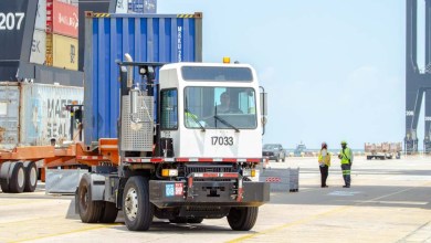 a container being moved by port yard truck in Houston
