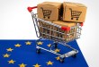 A shopping cart with parcels sits on top of the EU flag to represent e-commerce in the regional block.