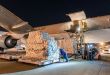 Night loading of pallets on a cargo jet.