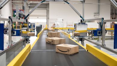 An automated conveyor system moves packages through an Amazon facility.