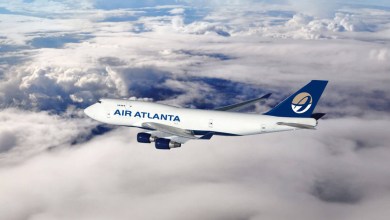 An Air Atlanta 747 jumbo cargo jet flies above the clouds.