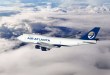 An Air Atlanta 747 jumbo cargo jet flies above the clouds.
