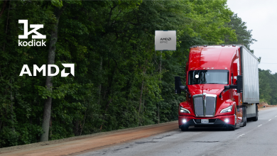 Red Kodiak AI tractor-trailer on a wooded highway, with an AMD EPYC chip callout on the cab