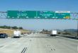 Southbound Interstate 15 and 215 split in Southern California, with a box truck in the I-15 truck bypass lane toward Los Angeles and San Diego.