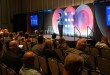 Kara Brown, CEO and co-founder of LeadCoverage, speaks on stage about intent data and AI-driven marketing at a supply chain conference