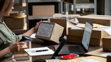 An office worker prepares a package for shipping.