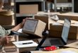 An office worker prepares a package for shipping.
