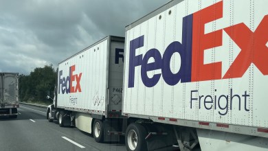 Two FedEx Freight pup trailers on a highway