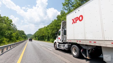 XPO daycab pulling an XPO trailer on a highway