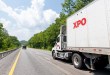 XPO daycab pulling an XPO trailer on a highway