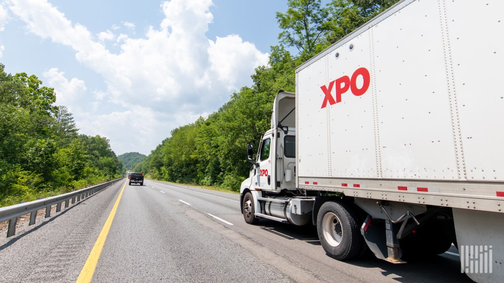 XPO daycab pulling an XPO trailer on a highway