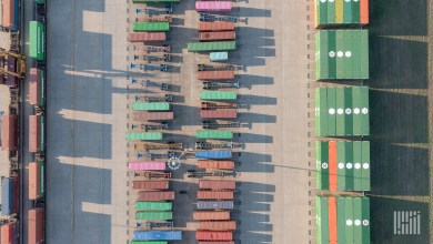 Over the top view of intermodal chassis and containers next to a rail line showing the potential for yard automation