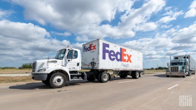 a FedEx Freight pup trailer being pulled on a highway