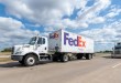 a FedEx Freight pup trailer being pulled on a highway