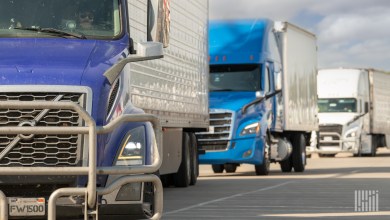 tractor-trailers pulling onto a highway