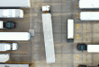 A busy truck yard with terminal tractors and trailers in parking spots Primary focus keyword: yard automation