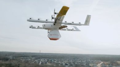 A multi-rotor drone carrying a DoorDash load flies through the air.