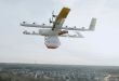A multi-rotor drone carrying a DoorDash load flies through the air.
