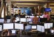 Flexport employees work at rows of monitors as the company launches an MCP server for AI agents to book freight