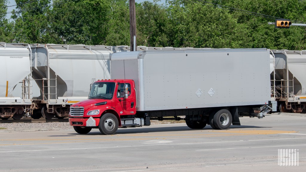 a red truck with a liftgate
