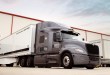 Plus AI autonomous truck hauling a Ryder branded trailer in front of a dock
