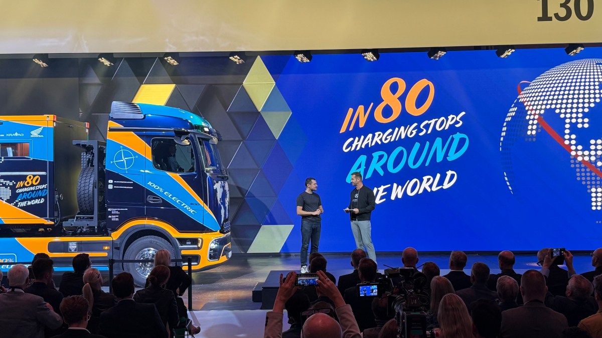 Tobias Wagner, a professional driver and content creator known as the "Elektrotrucker," showing of an eActros 600 he'll take on the word tour