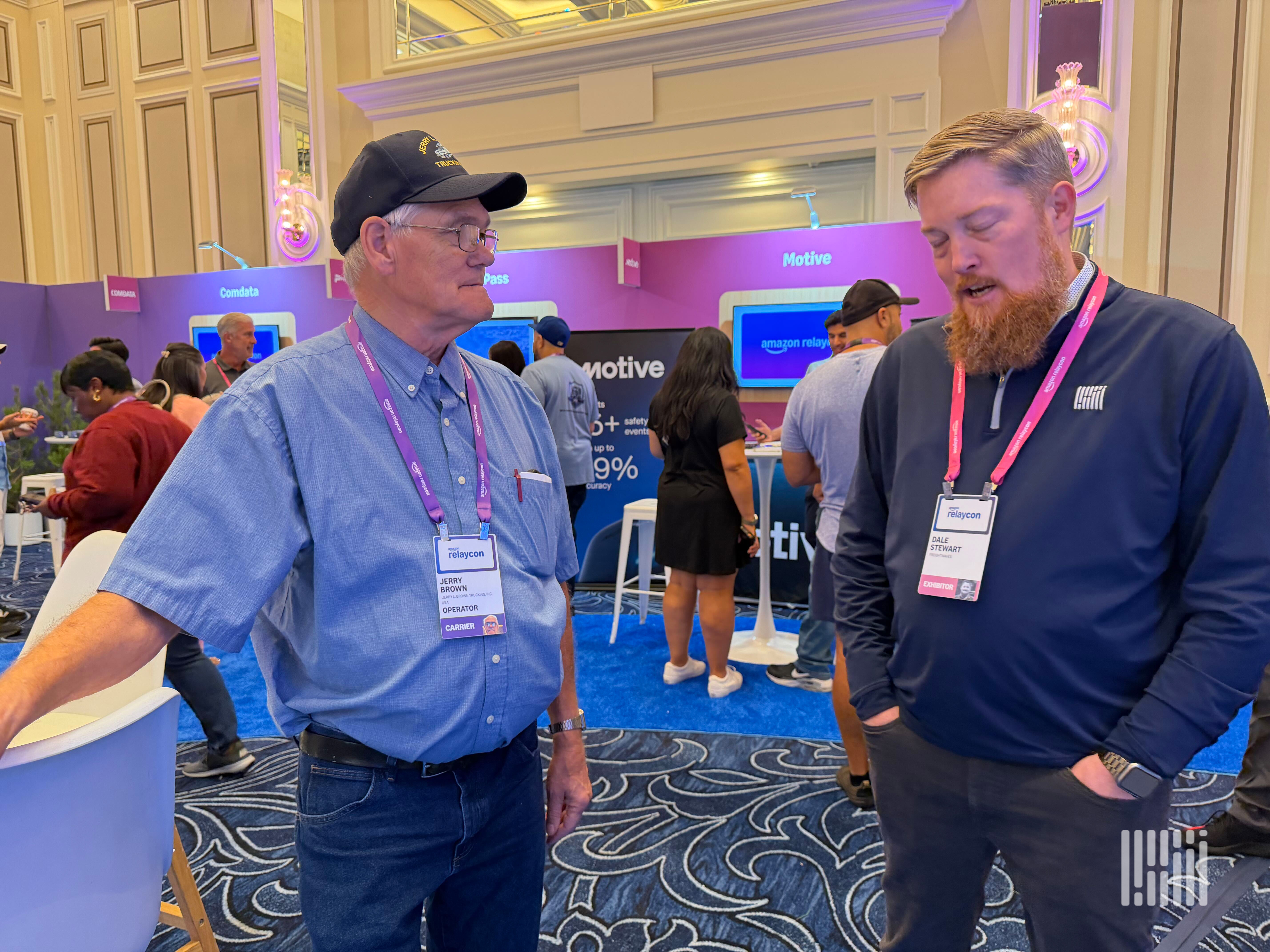 (Photo: Adam L. Wingfield, FreightWaves. Dale Stewart, talks with an operator of 40 plus years at RelayCon about the benefits of being a Relay carrier.)