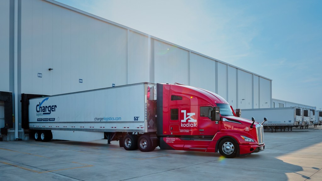 Kodiak autonomous truck hauling Charger Logistics freight on the Dallas-Laredo lane in Texas at a warehouse dock
