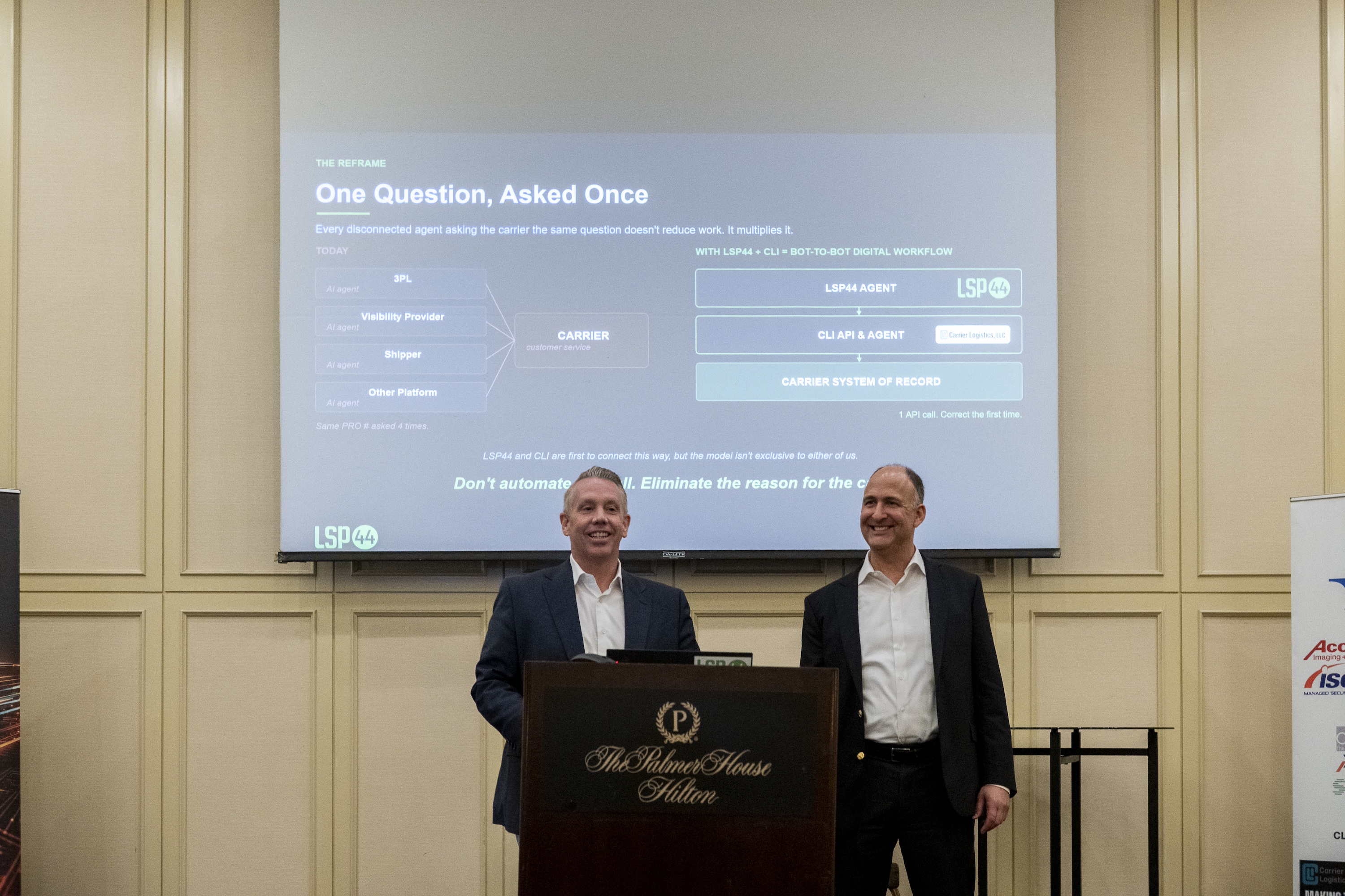 LSP44 head of sales Jeremy Estep and Carrier Logistics President Ben Wiesen announce the partnership at CLI’s user group conference in Chicago. (Photo: Carrier Logistics)