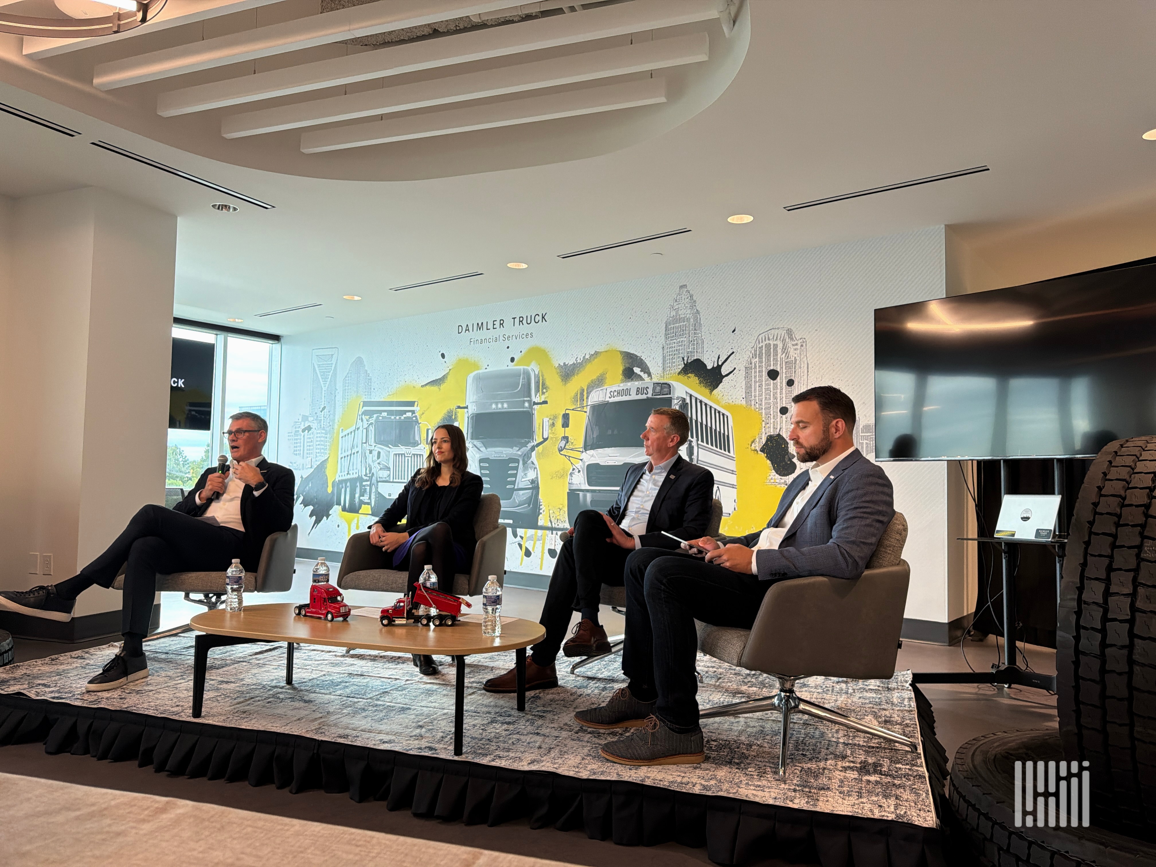 Daimler Truck leaders field questions during a fireside chat at the company’s new financial services headquarters in Charlotte. (Photo: Adam L. Wingfield, FreightWaves)