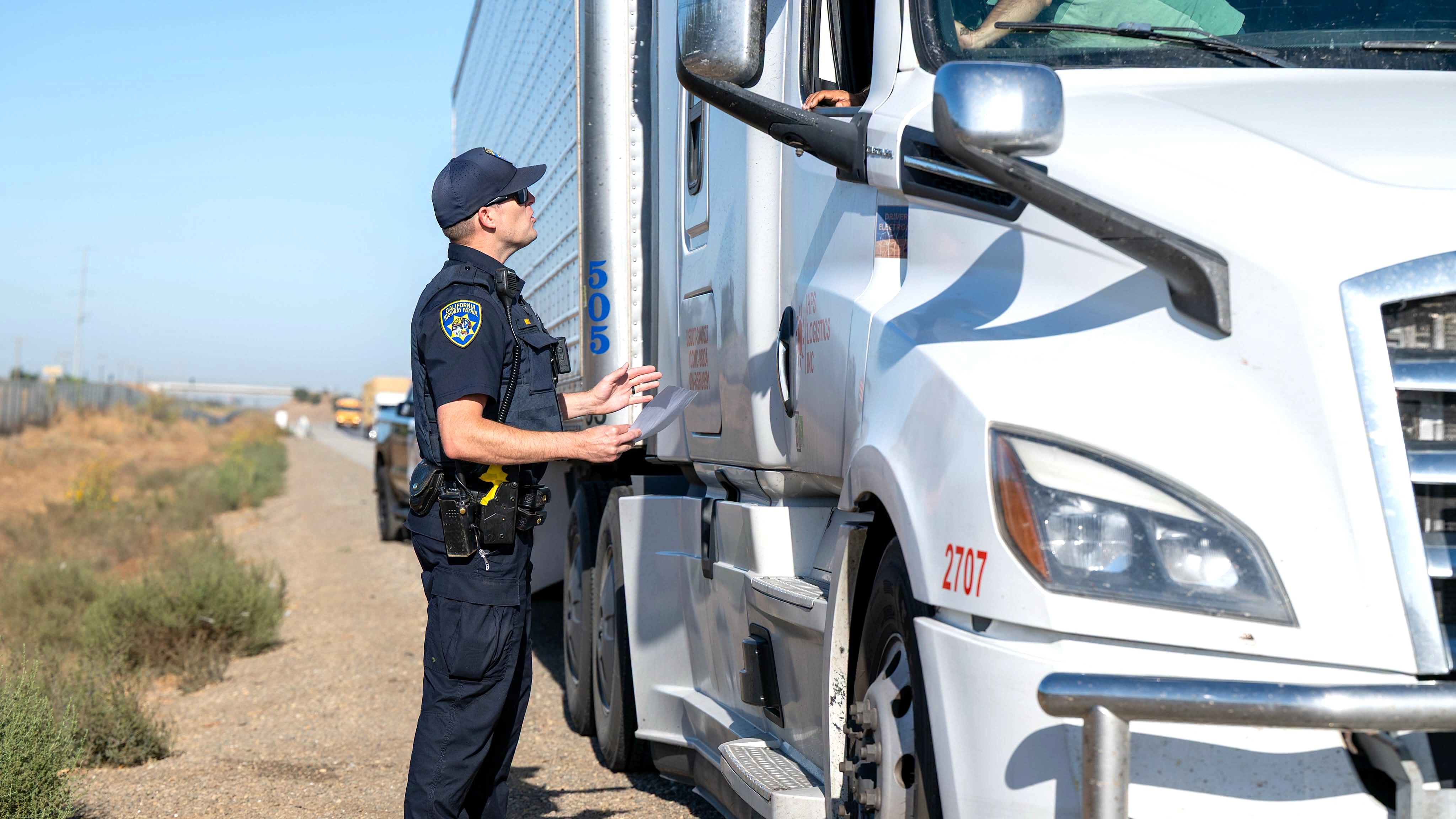 Commercial vehicle enforcement operations in Arizona, California, Kentucky and North Dakota resulted in hundreds of citations and violations. Pictured is a California Highway Patrol-Merced officer talking with a truck driver during a recent roadside compliance enforcement. (Photo: CHP-Merced)