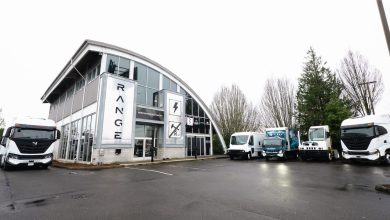 Range Zero Emissions commercial vehicles sitting next to a Range Zero Emissions dealership