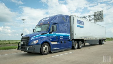 a Blue Marten sleeper cab pulling a white Marten trailer
