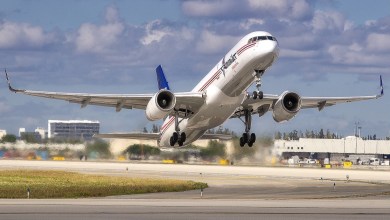 An Amerijet freighter takes off on a sunny day from Miami airport.