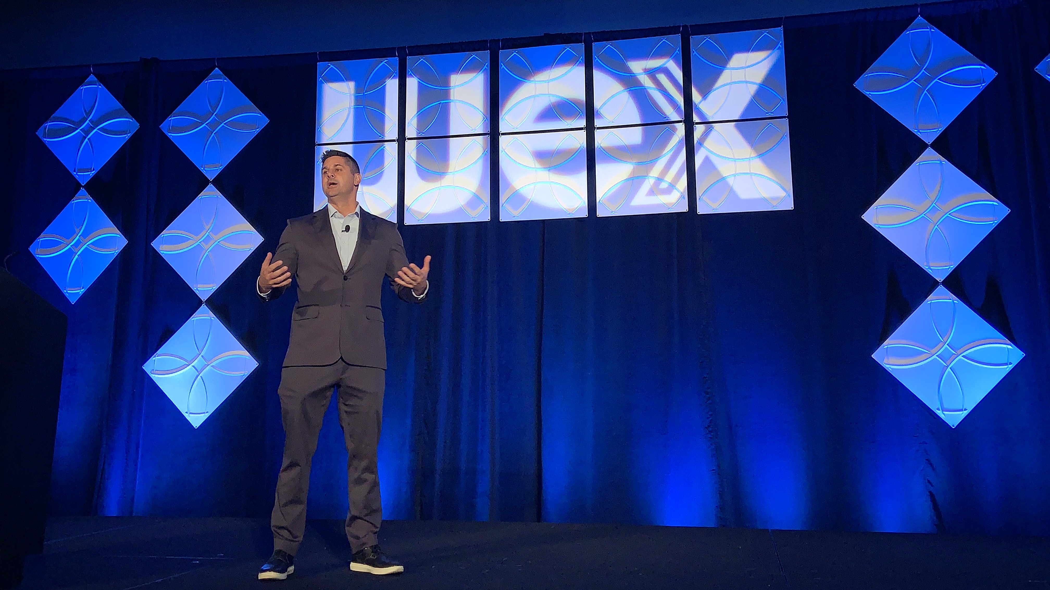 Knight-Swift CEO Adam Miller told the WEX OTR Summit that regulatory enforcement and shrinking trucking capacity are creating an unusual freight market despite relatively weak demand. (Photo FreightWaves)