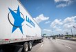 side view of a Landstar trailer on a highway