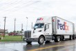 FedEx Freight tractor pulling two LTL trailers